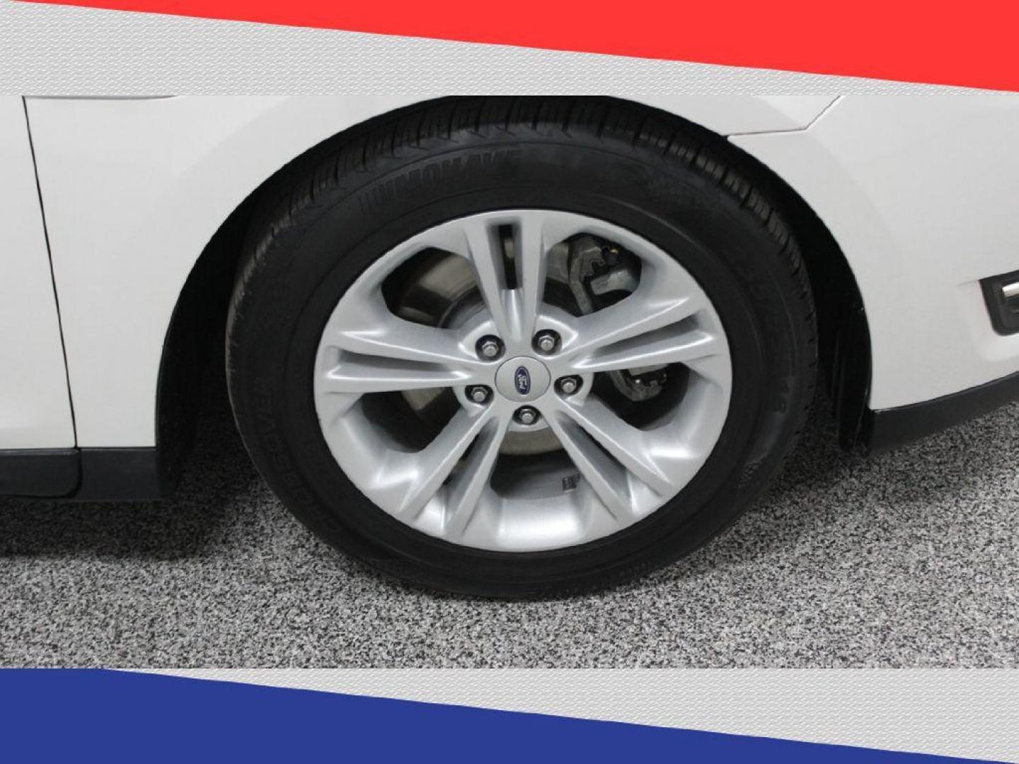 2015 Ford Taurus SEL FWD (1FAHP2E95FG) with an 2.0L L4 DOHC 16V engine, 6-Speed Automatic transmission, located at 5170 N La Cholla Blvd, Tucson, AZ, 85705, (520) 989-0282, 32.228245, -111.011742 - 2015 Ford Taurus - Photo#34